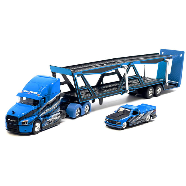Mack Anthem Open Car Hauler Blue with Graphics and 1993 Chevrolet 454 SS Pickup Truck Blue with Graphics "Toyo Tires" "Transporters" Series 1/64 Diecast Models by Maisto