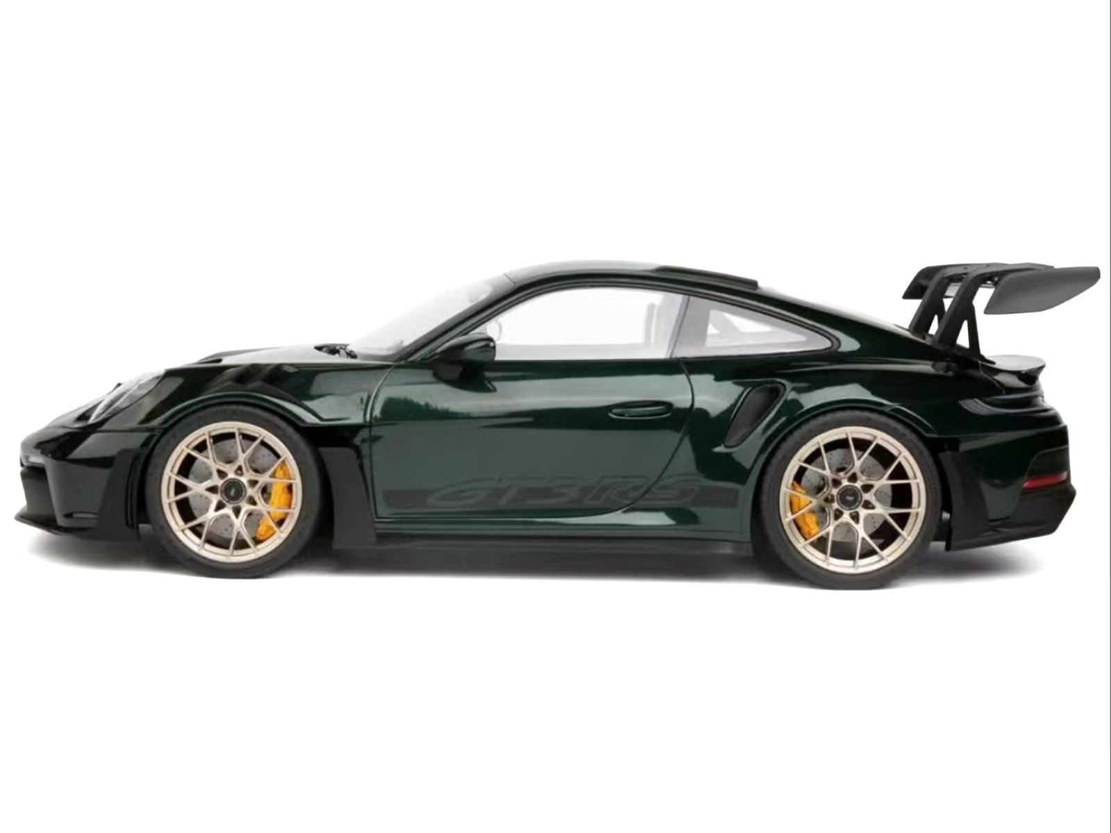 Green sports car with large spoiler.