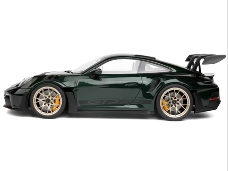 Green sports car with large spoiler.