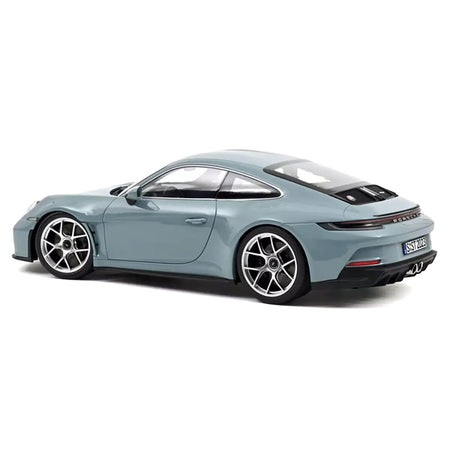 Blue sports car from the side.