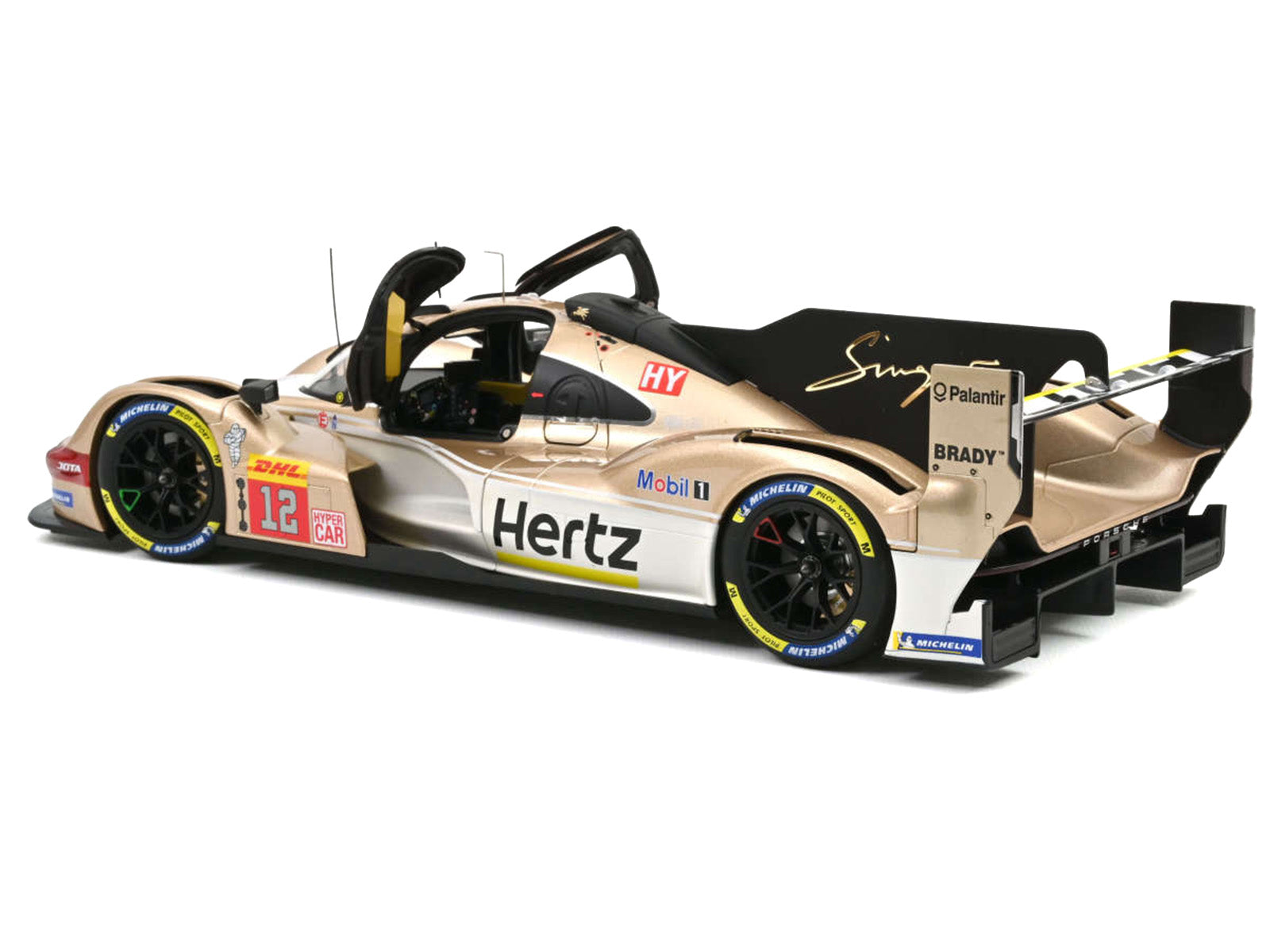 Gold and black race car with sponsor logos.