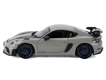 Gray sports car model with blue wheels.