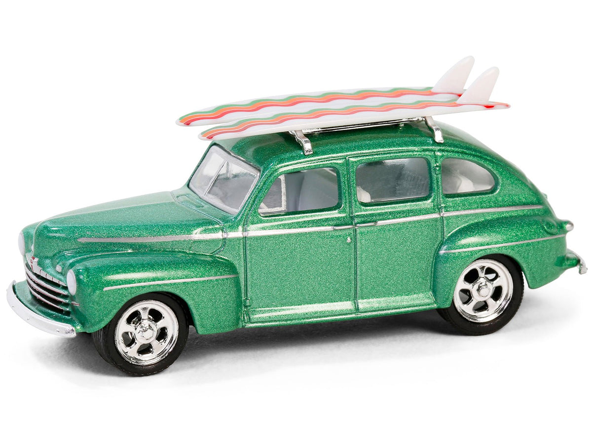 1946 Ford Fordor Super Deluxe Green Metallic with White Interior and Roof Rack with Surfboards "The Hobby Shop" Series 16 1/64 Diecast Model Car by Greenlight-Greenlight-ModelCars.com