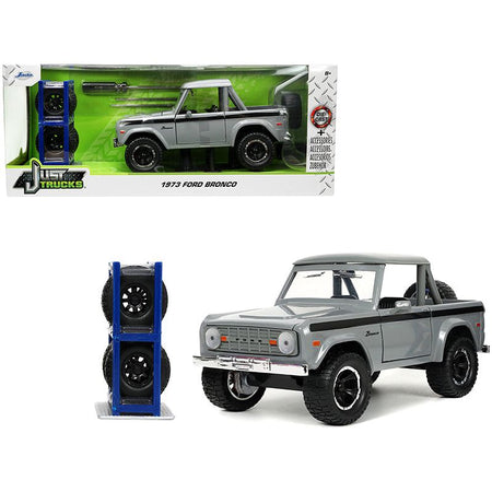 1973 Ford Bronco Pickup Truck Gray with Black Stripes with Extra Wheels "Just Trucks" Series 1/24 Diecast Model Car by Jada - Jada - ModelCars.com