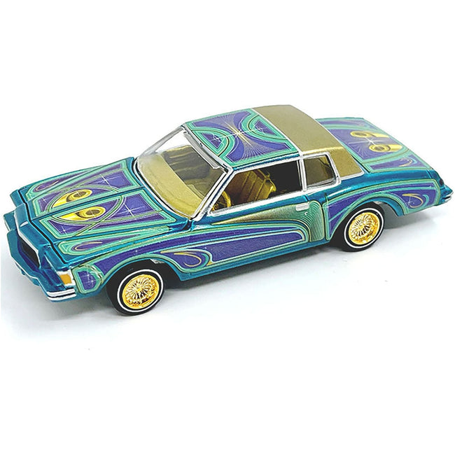 1978 Chevrolet Monte Carlo Lowrider Blue Metallic with Graphics and Gold Metallic Interior with Diecast Figure Limited Edition to 3600 pieces Worldwide 1/64 Diecast Model Car by Johnny Lightning-Johnny Lightning-ModelCars.com