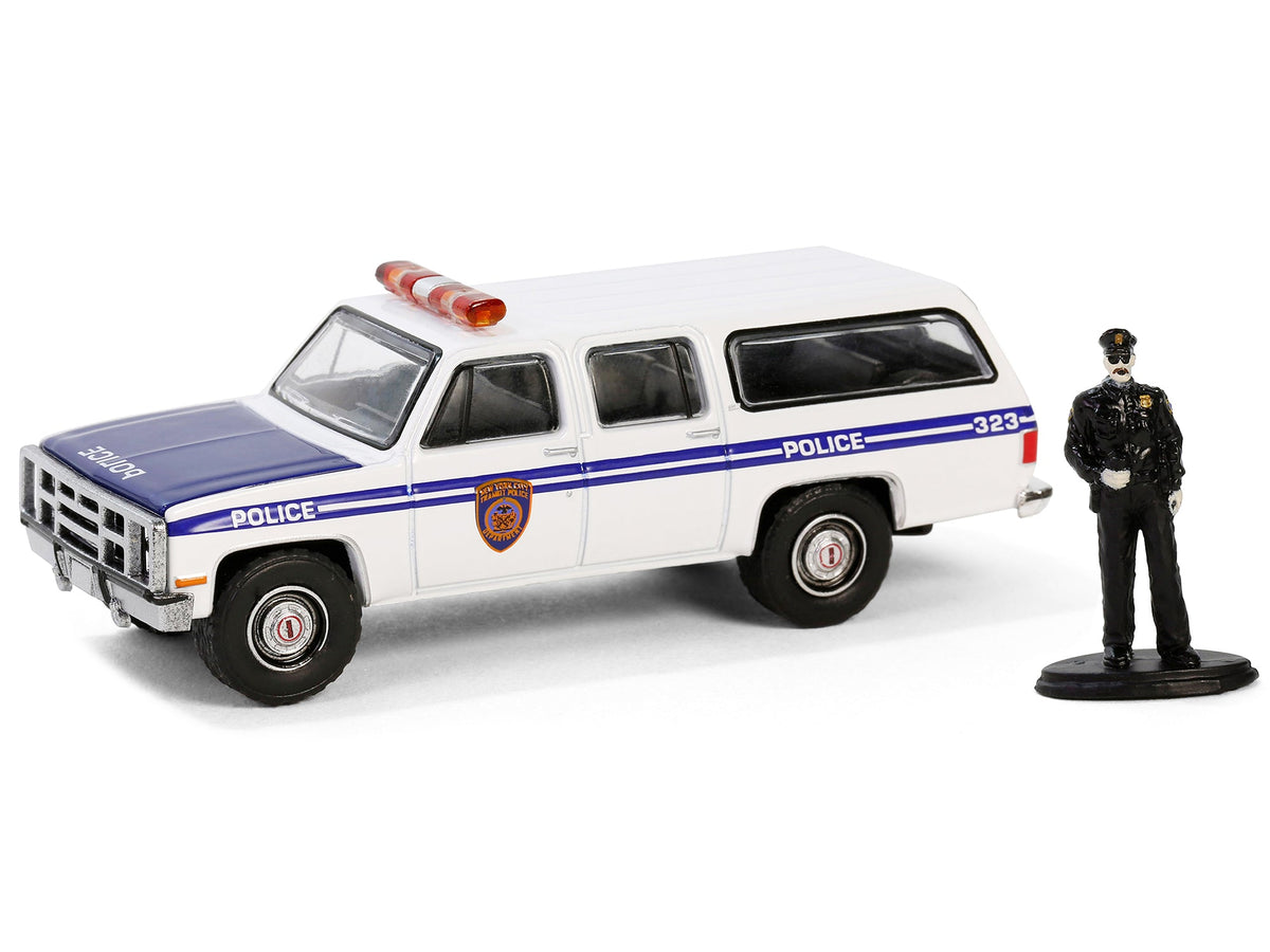 1985 GMC Suburban 2500 "New York City Transit Police Department" White with Blue Stripes and Police Officer Figure "The Hobby Shop" Series 16 1/64 Diecast Model Car by Greenlight-Greenlight-ModelCars.com