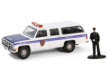 1985 GMC Suburban 2500 "New York City Transit Police Department" White with Blue Stripes and Police Officer Figure "The Hobby Shop" Series 16 1/64 Diecast Model Car by Greenlight-Greenlight-ModelCars.com
