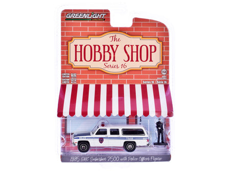 1985 GMC Suburban 2500 "New York City Transit Police Department" White with Blue Stripes and Police Officer Figure "The Hobby Shop" Series 16 1/64 Diecast Model Car by Greenlight-Greenlight-ModelCars.com