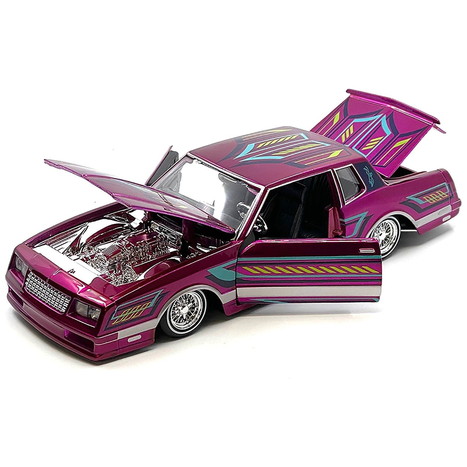 1986 Chevrolet Monte Carlo SS Lowrider Pink Metallic with Graphics "Lowriders" Series 1/24 Diecast Model Car by Maisto - Maisto - ModelCars.com