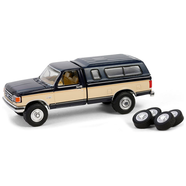 1991 Ford F - 150 XLT Lariat Pickup Truck with Camper Shell Deep Shadow Blue and Tan with Spare Tires "The Hobby Shop" Series 16 1/64 Diecast Model Car by Greenlight - Greenlight - ModelCars.com