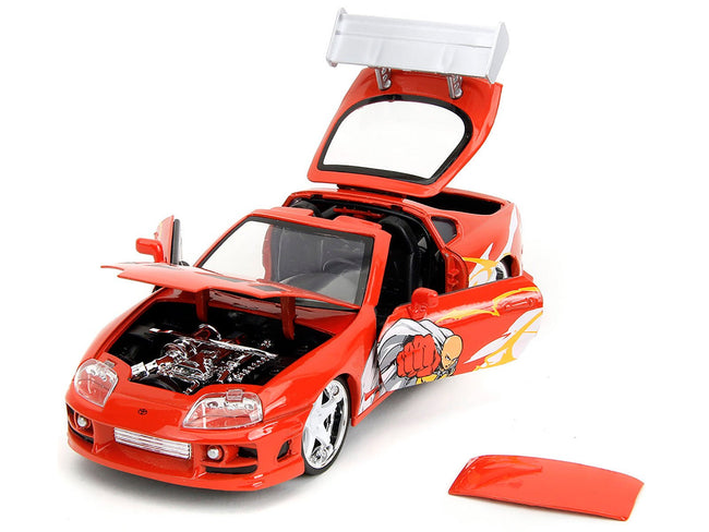 1995 Toyota Supra Red with Graphics and Saitama Diecast Figure "One Punch Man" (2015-2019) TV Series 1/24 Diecast Model by Jada-Jada-ModelCars.com