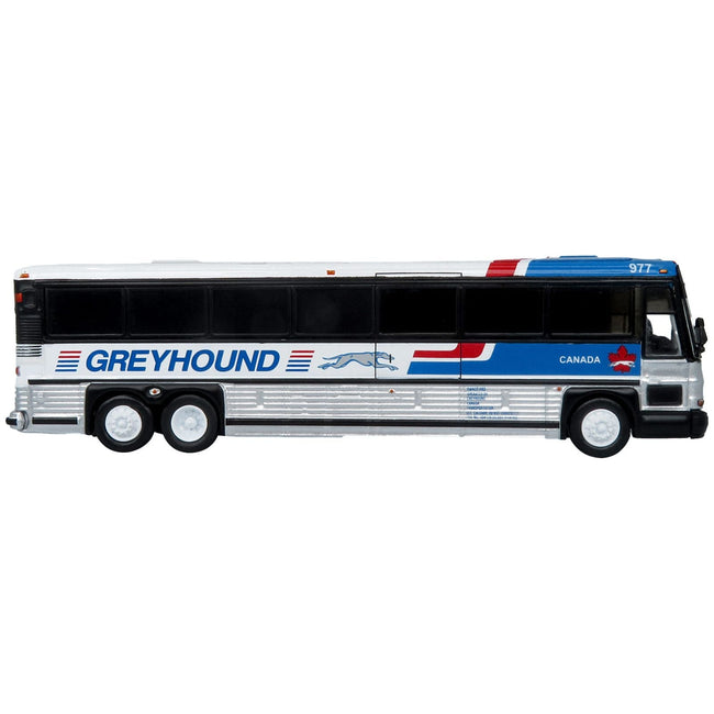 2001 MCI D4000 Coach Bus "Greyhound Canada" Blue and White with Red Stripes "Vintage Bus & Motorcoach Collection" Limited Edition to 504 pieces Worldwide 1/87 (HO) Diecast Model by Iconic Replicas - Iconic Replicas - ModelCars.com