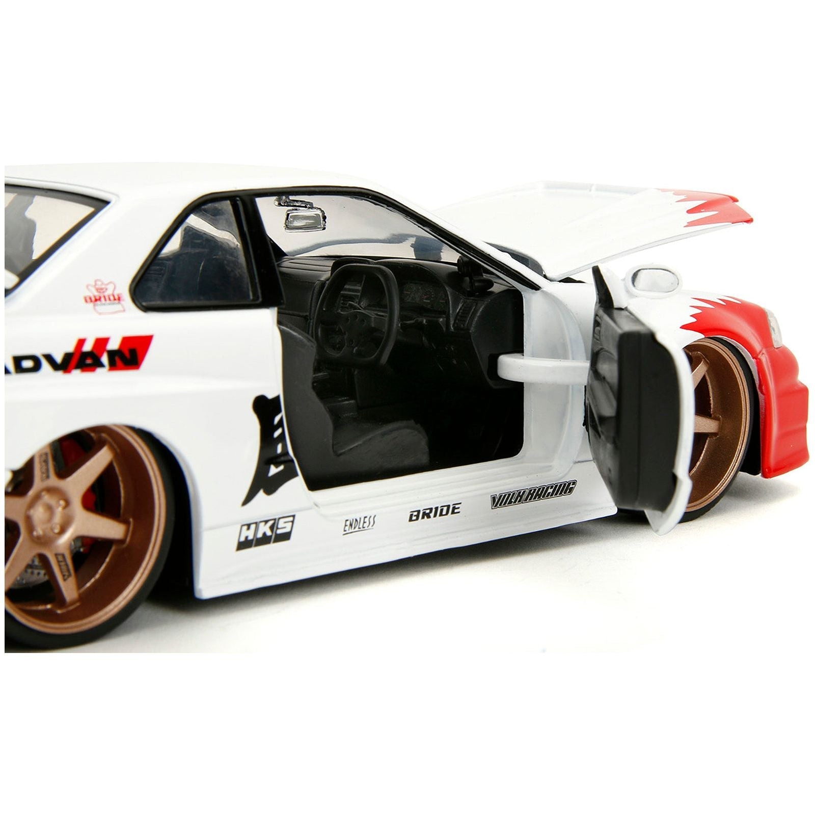 2002 Nissan Skyline GT - R (R34) RHD (Right Hand Drive) White with Red Graphics and Ryu Diecast Figure "Street Fighter" Video Game "Anime Hollywood Rides" Series 1/24 Diecast Model Car by Jada - Jada - ModelCars.com