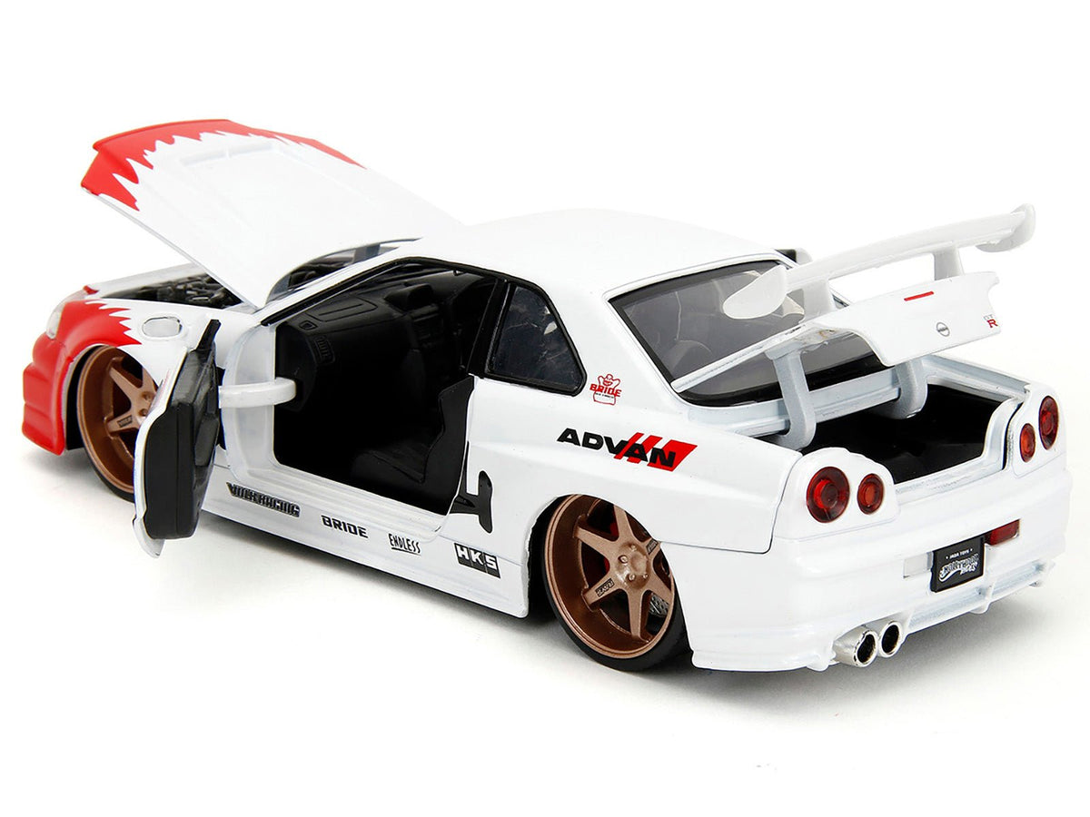 2002 Nissan Skyline GT-R (R34) RHD (Right Hand Drive) White with Red Graphics and Ryu Diecast Figure "Street Fighter" Video Game "Anime Hollywood Rides" Series 1/24 Diecast Model Car by Jada-Jada-ModelCars.com
