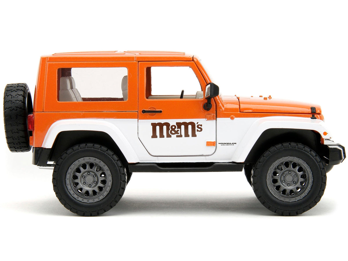 2007 Jeep Wrangler Orange Metallic and White and Orange M&M Diecast Figure "M&M's" "Hollywood Rides" Series 1/24 Diecast Model Car by Jada-Jada-ModelCars.com
