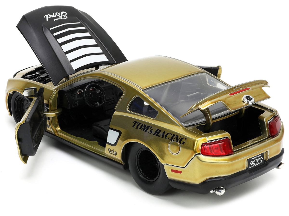 2010 Ford Mustang GT Gold Metallic with Black Graphics and Hood "Tom's Racing" "Bigtime Muscle" Series 1/24 Diecast Model Car by Jada-Jada-ModelCars.com