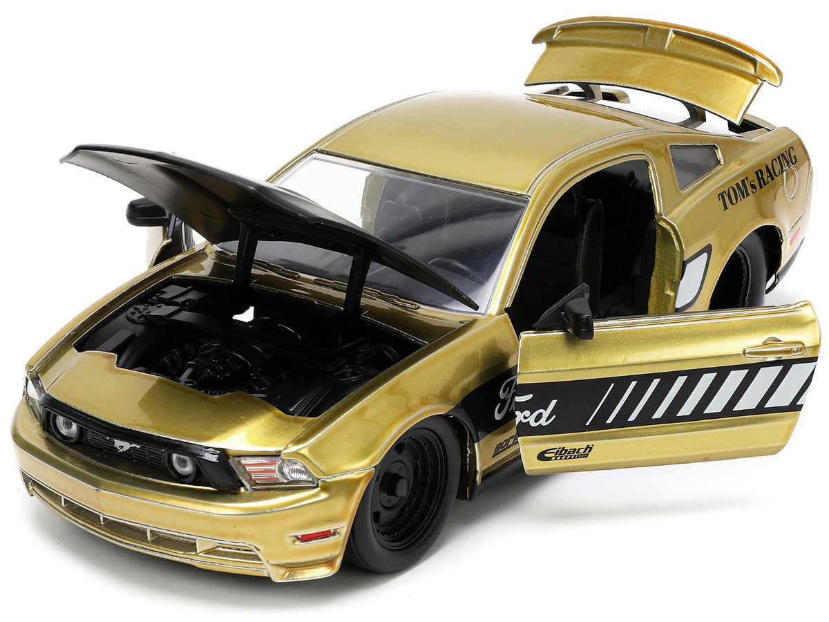 2010 Ford Mustang GT Gold Metallic with Black Graphics and Hood "Tom's Racing" "Bigtime Muscle" Series 1/24 Diecast Model Car by Jada-Jada-ModelCars.com