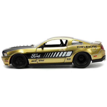 2010 Ford Mustang GT Gold Metallic with Black Graphics and Hood "Tom's Racing" "Bigtime Muscle" Series 1/24 Diecast Model Car by Jada - Jada - ModelCars.com