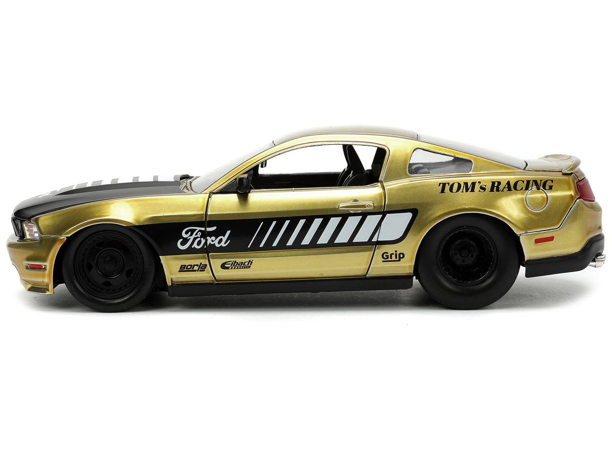 2010 Ford Mustang GT Gold Metallic with Black Graphics and Hood "Tom's Racing" "Bigtime Muscle" Series 1/24 Diecast Model Car by Jada-Jada-ModelCars.com