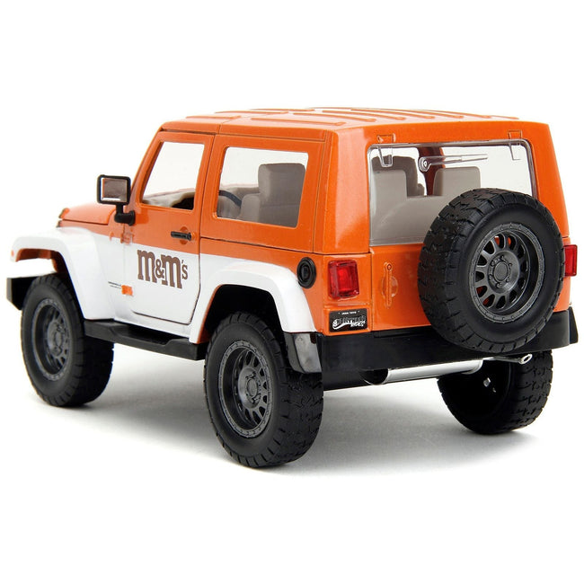 2017 Jeep Wrangler Orange Metallic and White and Orange M&M Diecast Figure "M&M's" "Hollywood Rides" Series 1/24 Diecast Model Car by Jada-Jada-ModelCars.com