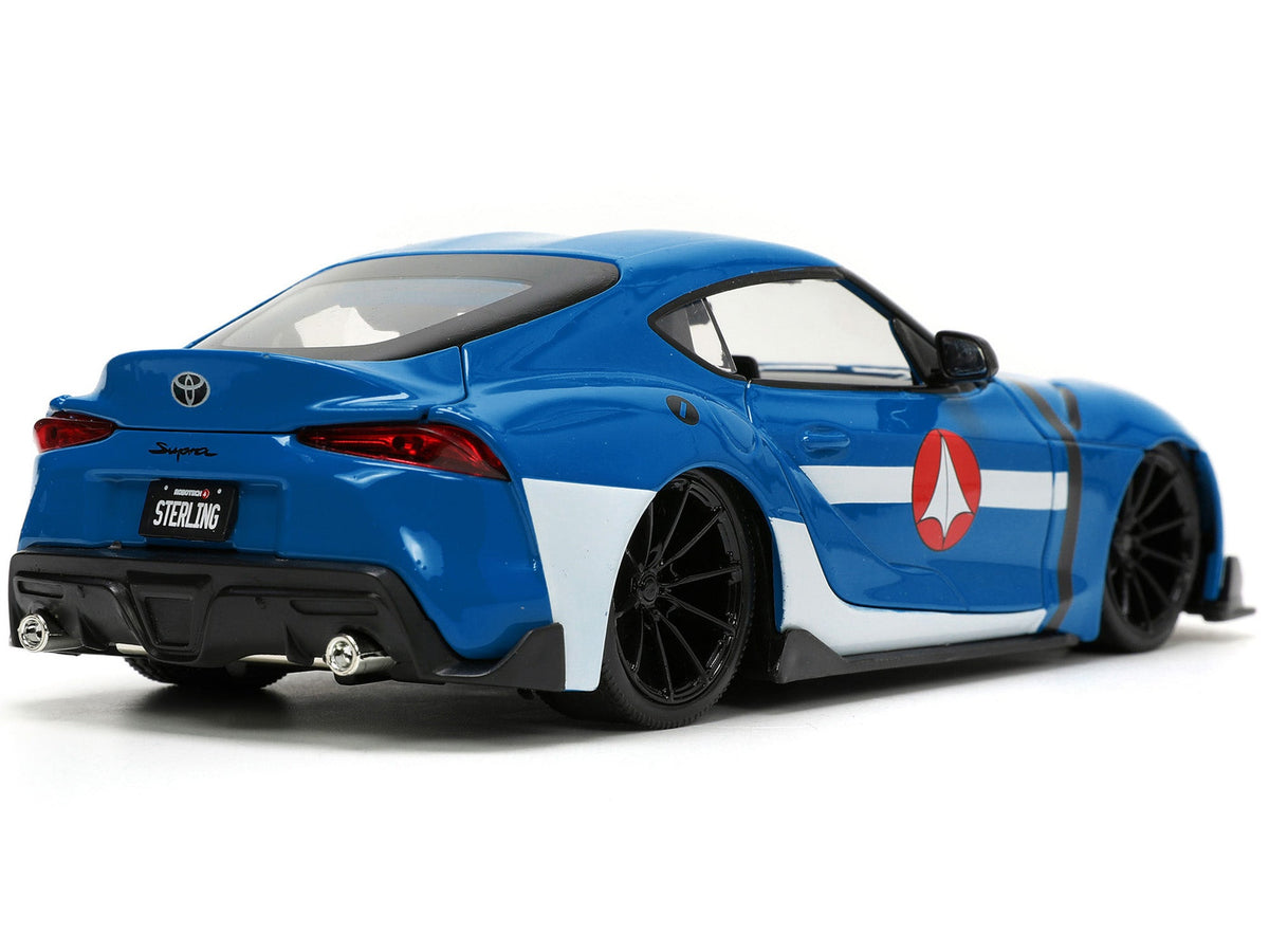 2020 Toyota Supra Blue with Graphics and Max Sterling Diecast Figurine "Robotech" "Hollywood Rides" Series 1/24 Diecast Model Car by Jada-Jada-ModelCars.com