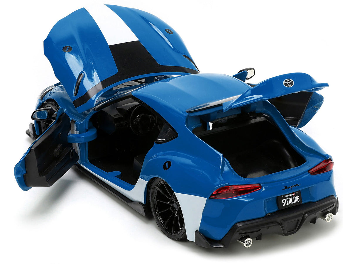 2020 Toyota Supra Blue with Graphics and Max Sterling Diecast Figurine "Robotech" "Hollywood Rides" Series 1/24 Diecast Model Car by Jada-Jada-ModelCars.com