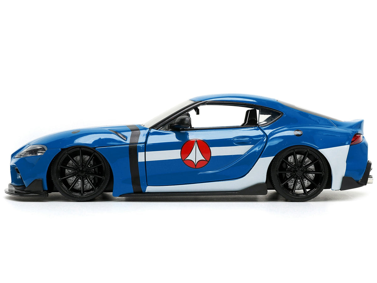 2020 Toyota Supra Blue with Graphics and Max Sterling Diecast Figurine "Robotech" "Hollywood Rides" Series 1/24 Diecast Model Car by Jada-Jada-ModelCars.com
