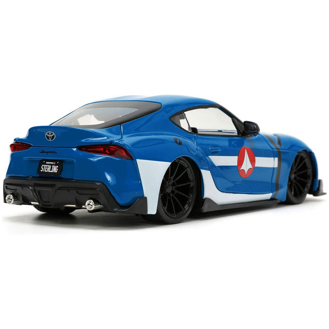 2020 Toyota Supra Blue with Graphics and Max Sterling Diecast Figurine "Robotech" "Hollywood Rides" Series 1/24 Diecast Model Car by Jada-Jada-ModelCars.com
