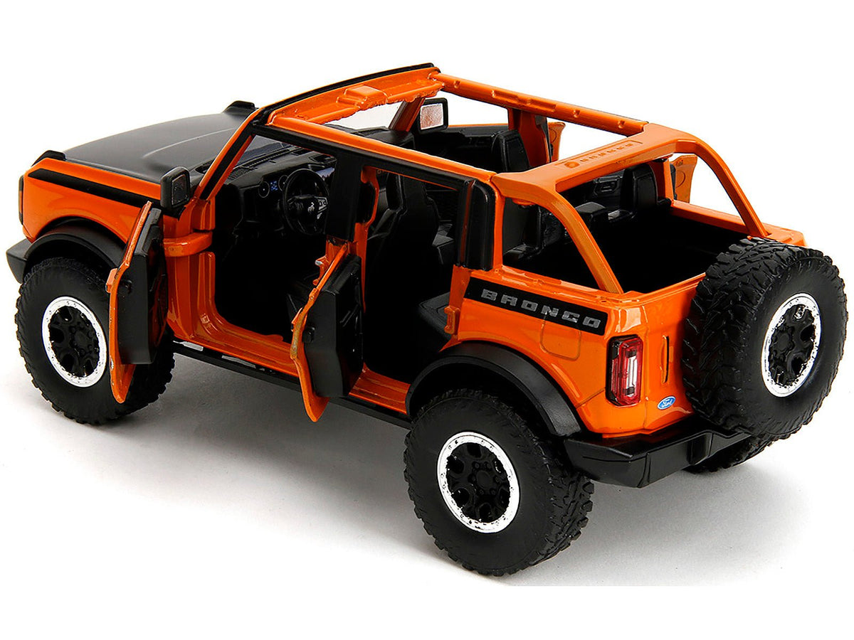 2021 Ford Bronco Open-Top Orange with Black Stripes and Hood with Extra Wheels "Just Trucks" Series 1/24 Diecast Model Car by Jada-Jada-ModelCars.com