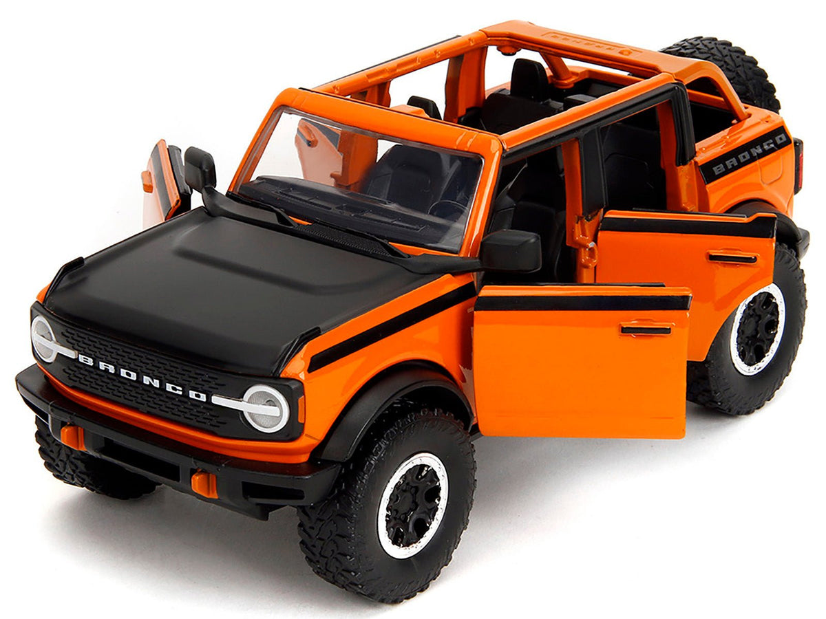 2021 Ford Bronco Open-Top Orange with Black Stripes and Hood with Extra Wheels "Just Trucks" Series 1/24 Diecast Model Car by Jada-Jada-ModelCars.com