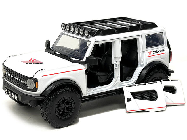 2021 Ford Bronco White with Red Stripes and Roof Rack "Yokohama Tires" "Just Trucks" Series 1/24 Diecast Model Car by Jada-Jada-ModelCars.com
