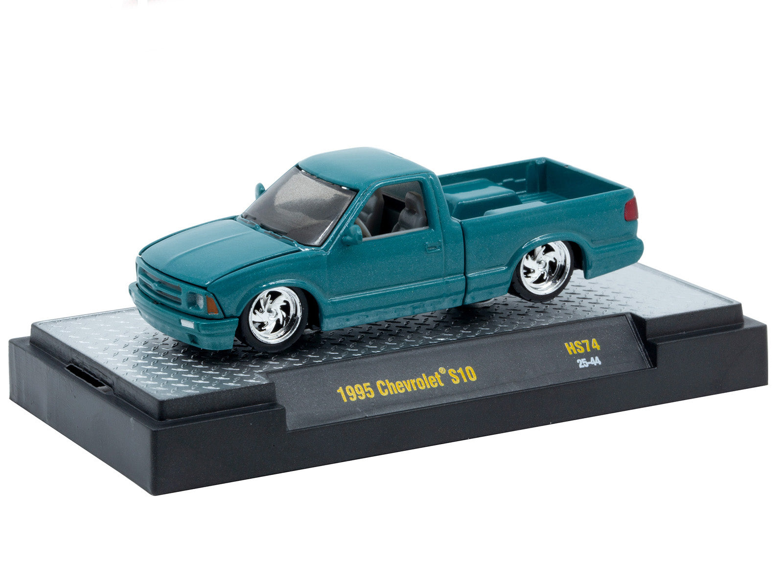 1995 Chevrolet S10 model car, HS74-1, teal, on display stand.