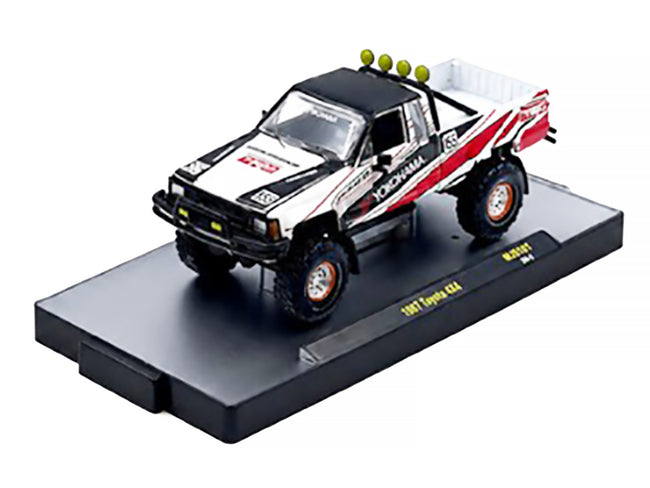 1985 Toyota SR5 4×4 Pickup Truck #85 "Yokohama" White with Black Top and Red and Black Graphics Limited Edition to 8250 pieces Worldwide 1/64 Diecast Model Car by M2 Machines