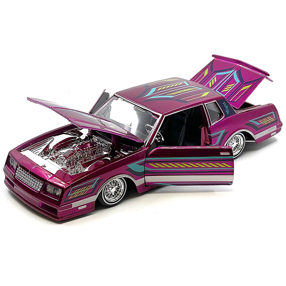 1986 Chevrolet Monte Carlo SS Lowrider Pink Metallic with Graphics "Lowriders" Series 1/24 Diecast Model Car by Maisto