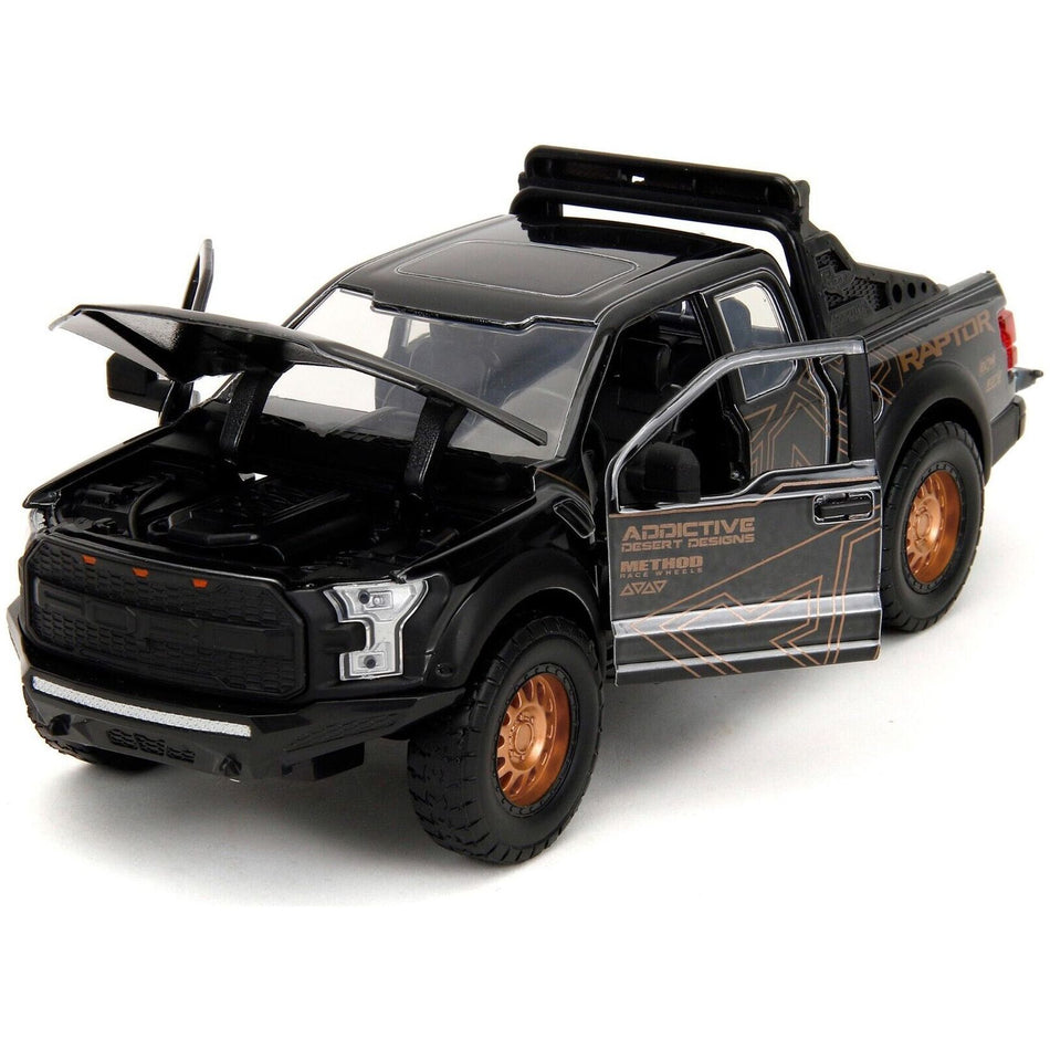 2017 Ford F-150 Raptor Pickup Truck Black with Gold Graphics "Pink Slips" Series 1/24 Diecast Model Car by Jada