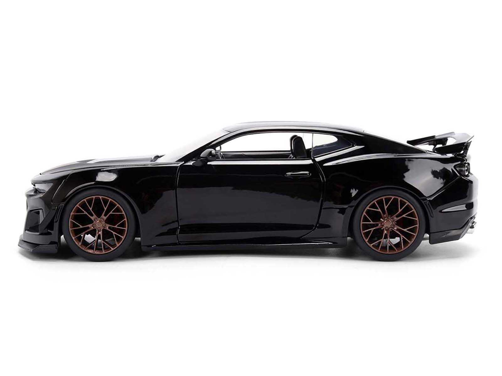 Black sports car with bronze wheels.