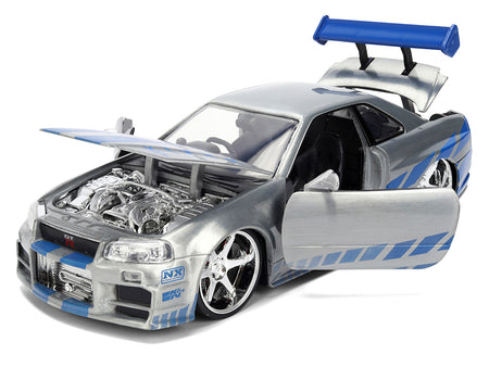 Silver toy car with open hood and door.