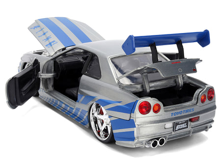 Silver and blue toy car with open doors and hood.