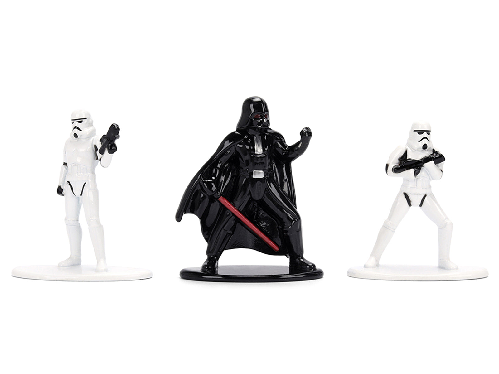 Star Wars figures of Darth Vader and two Stormtroopers.
