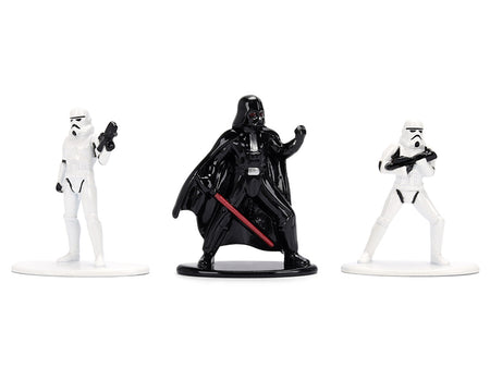 Star Wars figures of Darth Vader and two Stormtroopers.