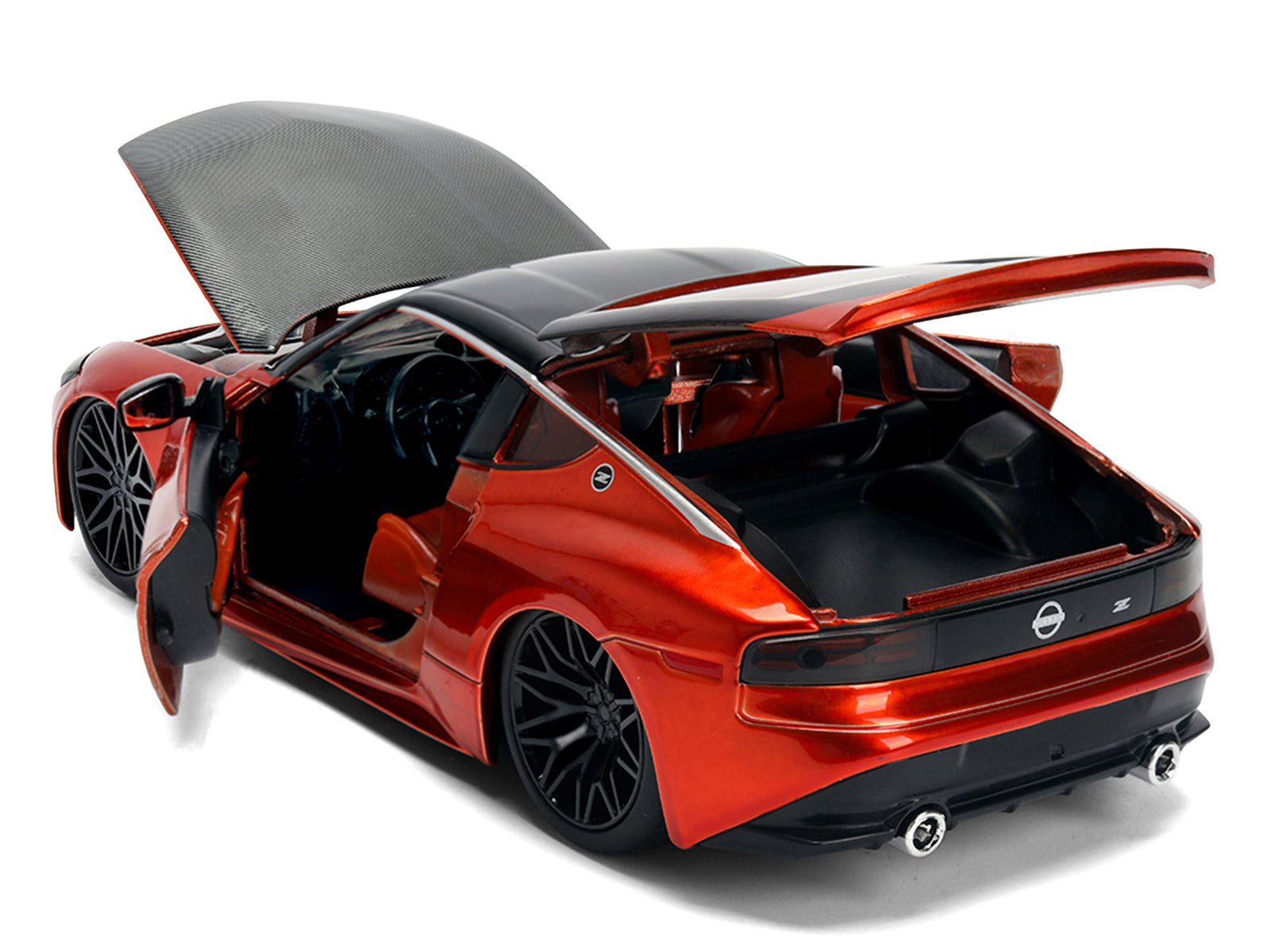 Red sports car with open doors and hood.
