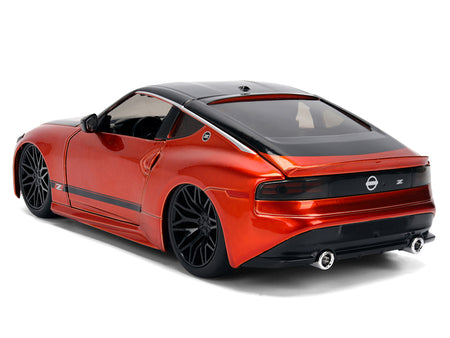 Orange sports car model with black wheels.