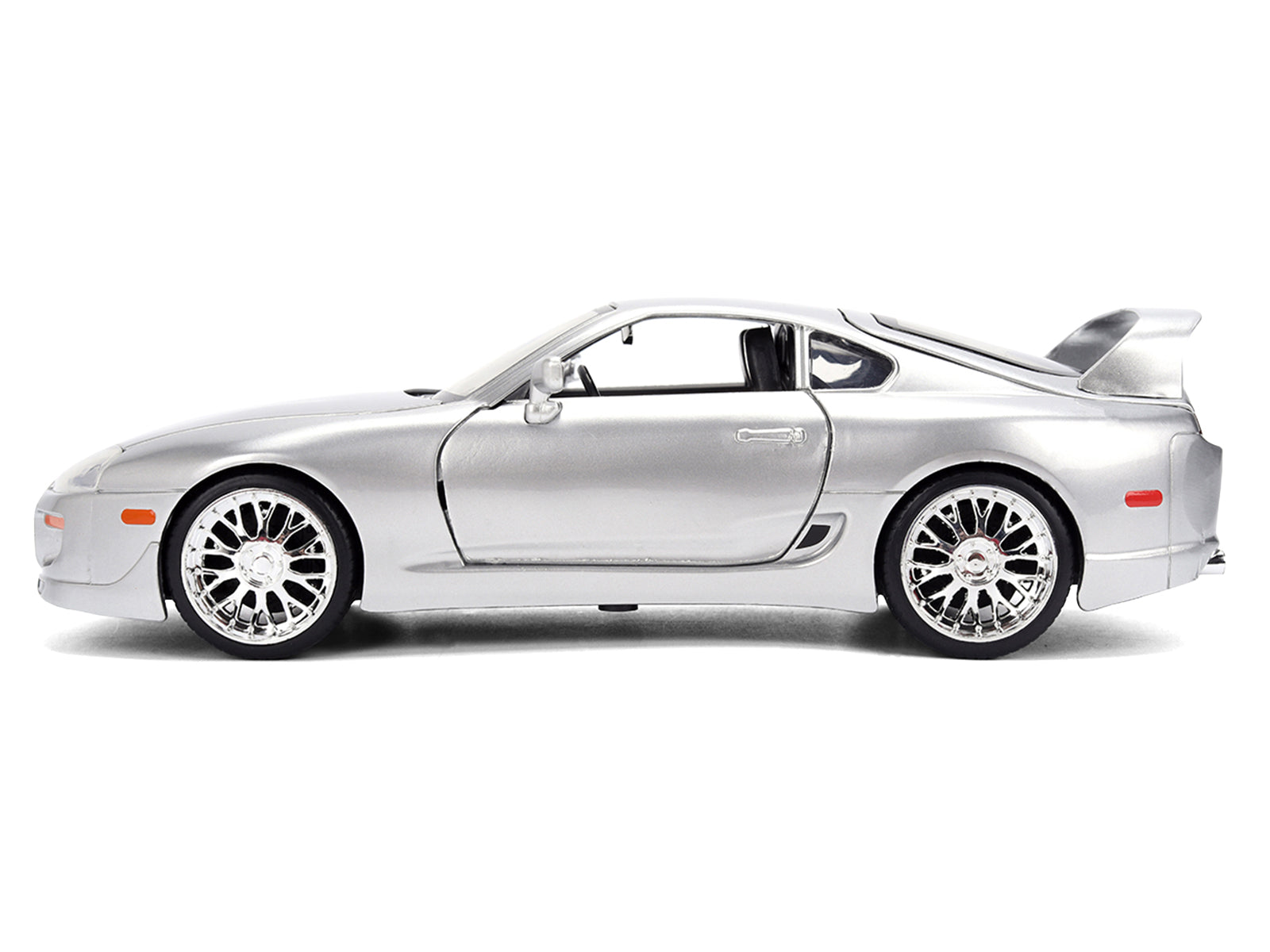 Silver sports car with spoiler.