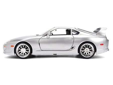 Silver sports car with spoiler.