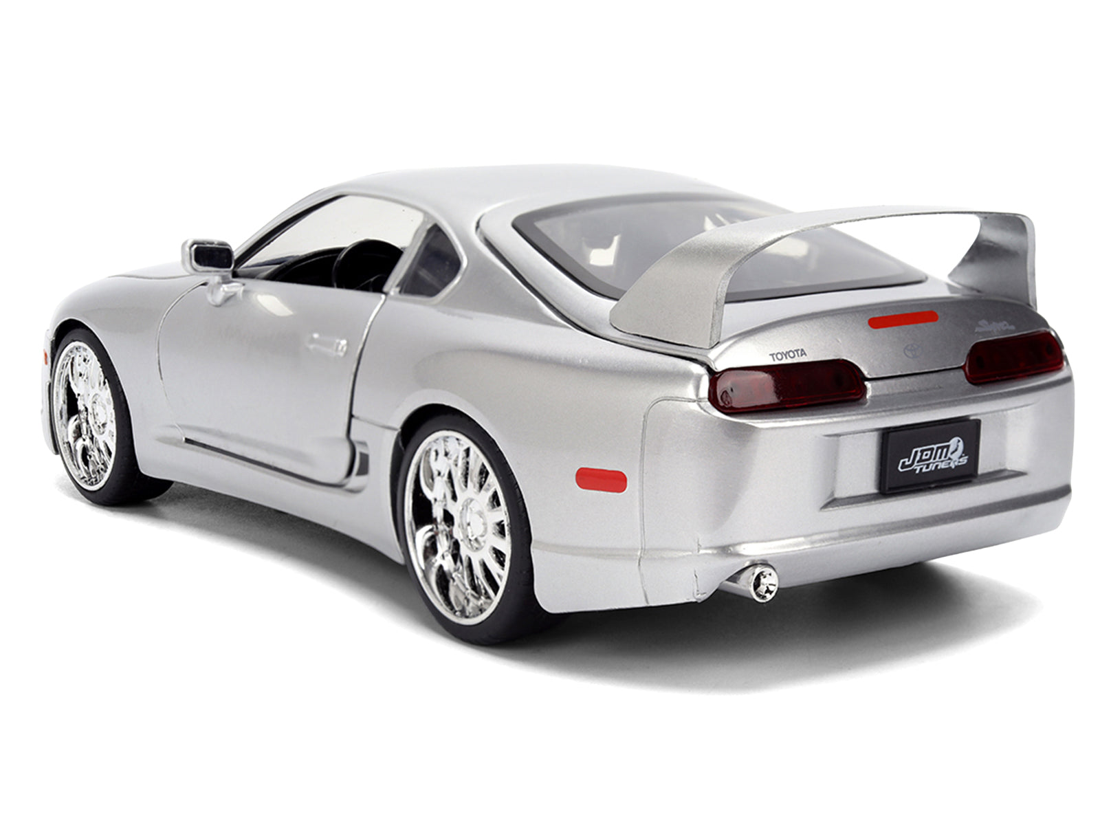 Silver sports car model on white background.