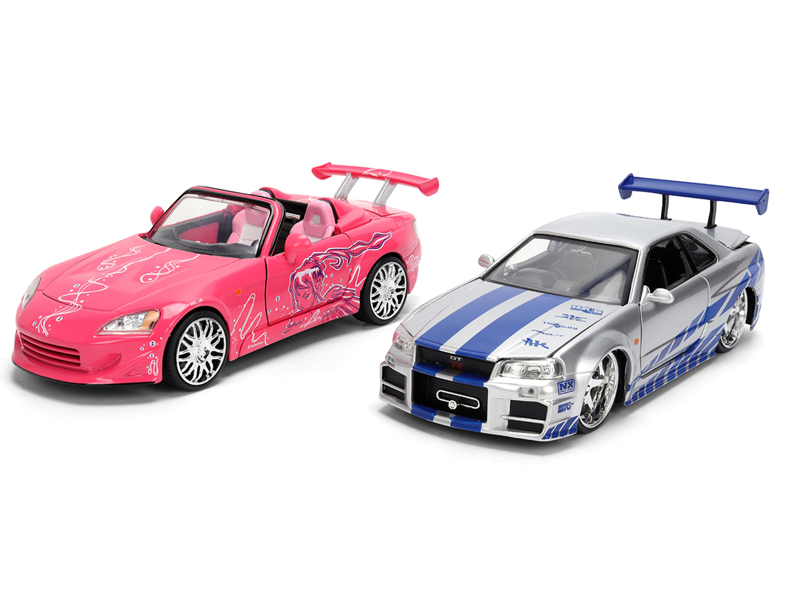 Brians Nissan Skyline GT-R (R34) Silver Metallic with Blue Stripes and Sukis Honda S2000 Pink with Graphics Set of 2 Cars "Fast & Furious 25th Anniversary" "Fast & Furious" Series 1/24 Diecast Model Cars by Jada