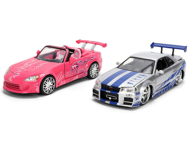 Brians Nissan Skyline GT-R (R34) Silver Metallic with Blue Stripes and Sukis Honda S2000 Pink with Graphics Set of 2 Cars "Fast & Furious 25th Anniversary" "Fast & Furious" Series 1/24 Diecast Model Cars by Jada