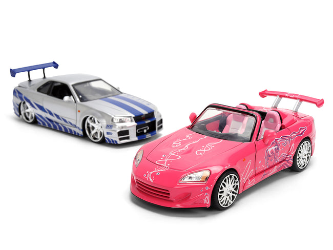 Brians Nissan Skyline GT-R (R34) Silver Metallic with Blue Stripes and Sukis Honda S2000 Pink with Graphics Set of 2 Cars "Fast & Furious 25th Anniversary" "Fast & Furious" Series 1/24 Diecast Model Cars by Jada