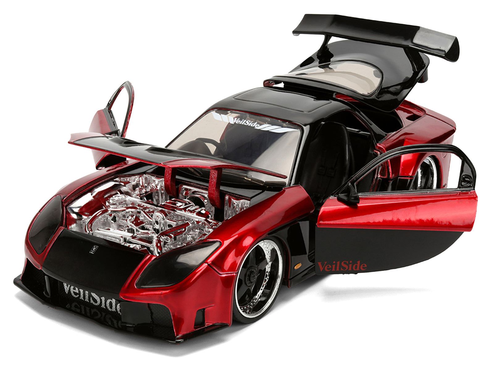 Red and black sports car model with open doors and hood.