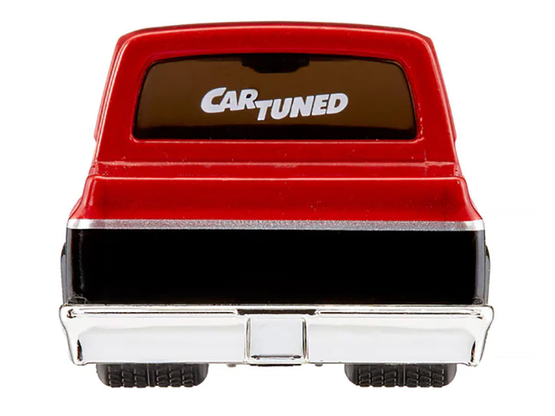 Red and black toy truck from the rear.